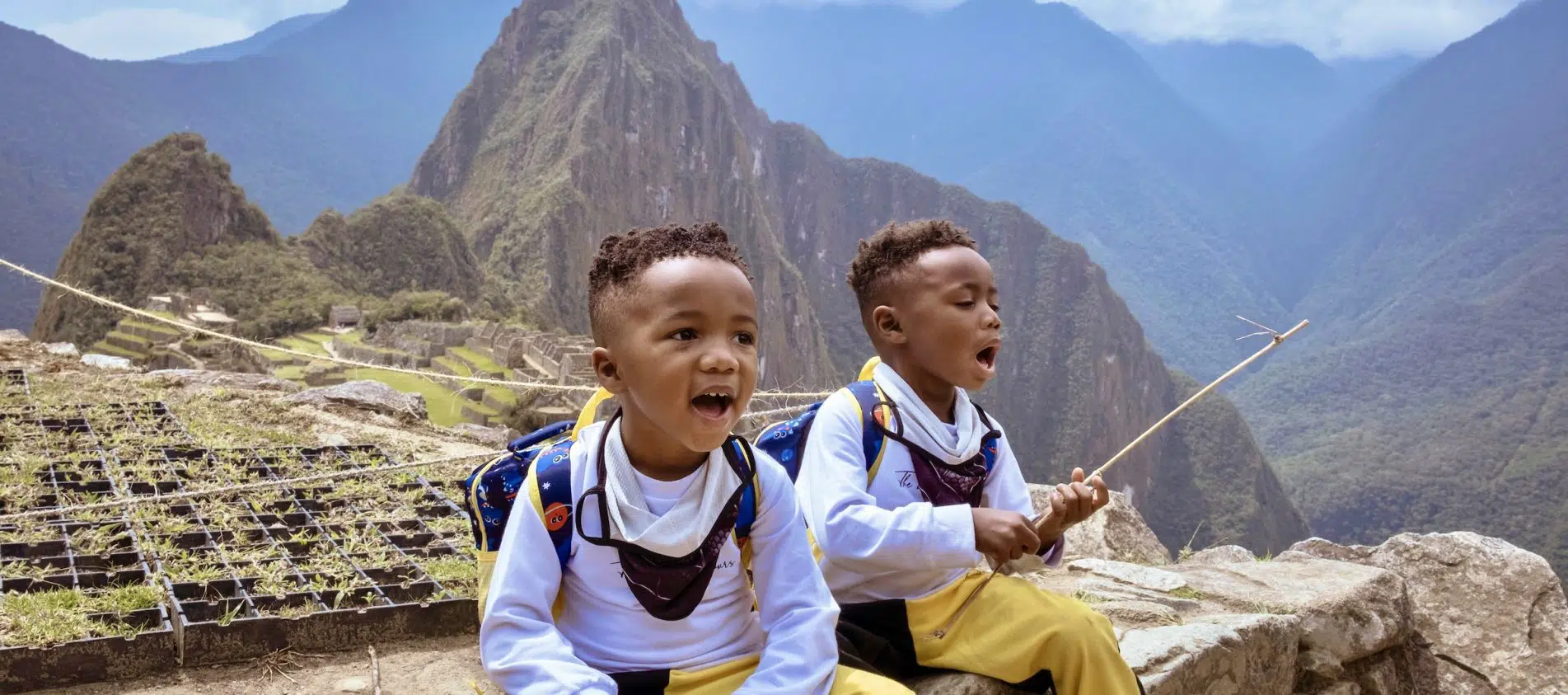 My twin boys, 4 years old, taking a break from hiking at Machu Picchu.