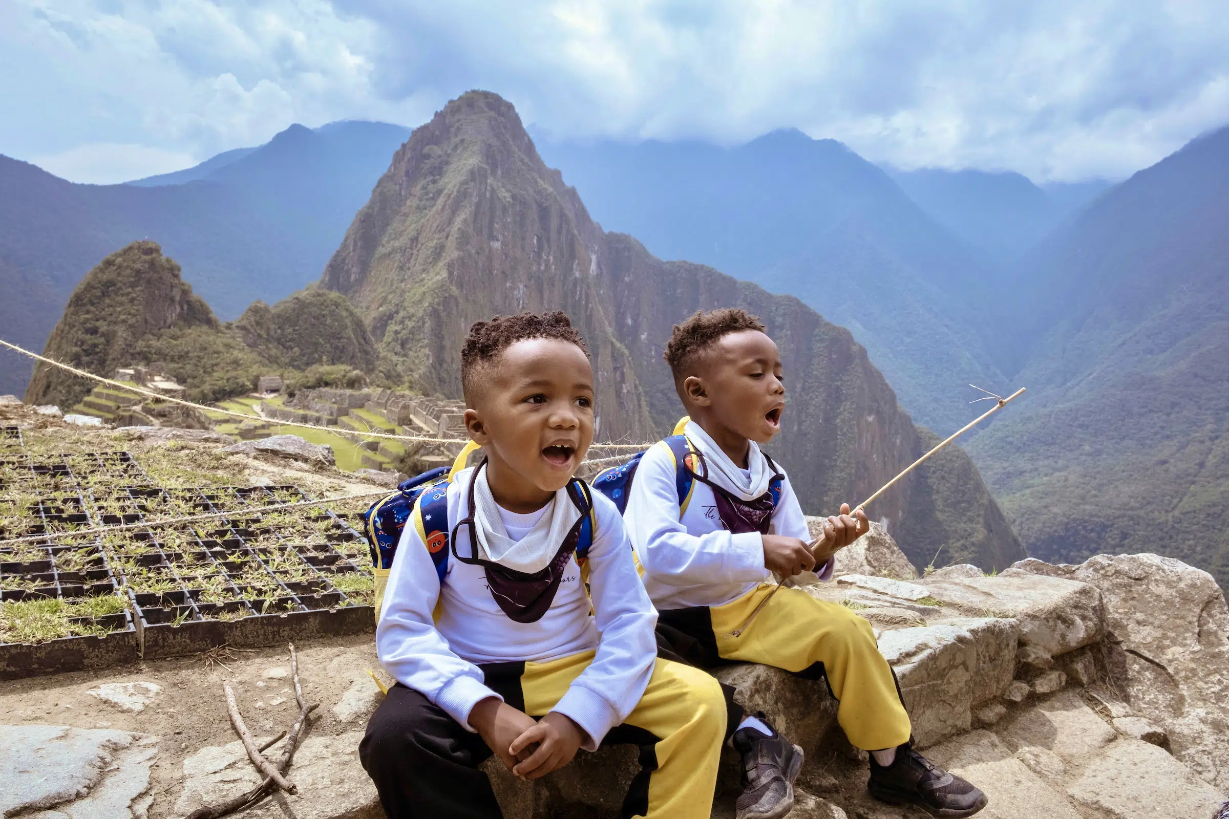 My twin boys, 4 years old, taking a break from hiking at Machu Picchu.