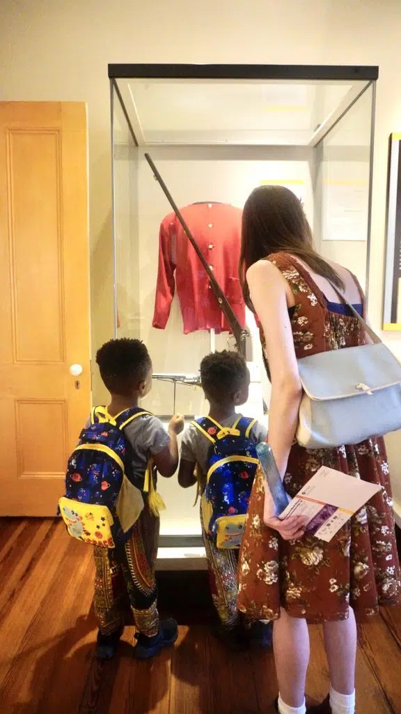The tour guide at the Reconstruction Museum in Columbia South Carolina explaining an exhibit to my twin boys 