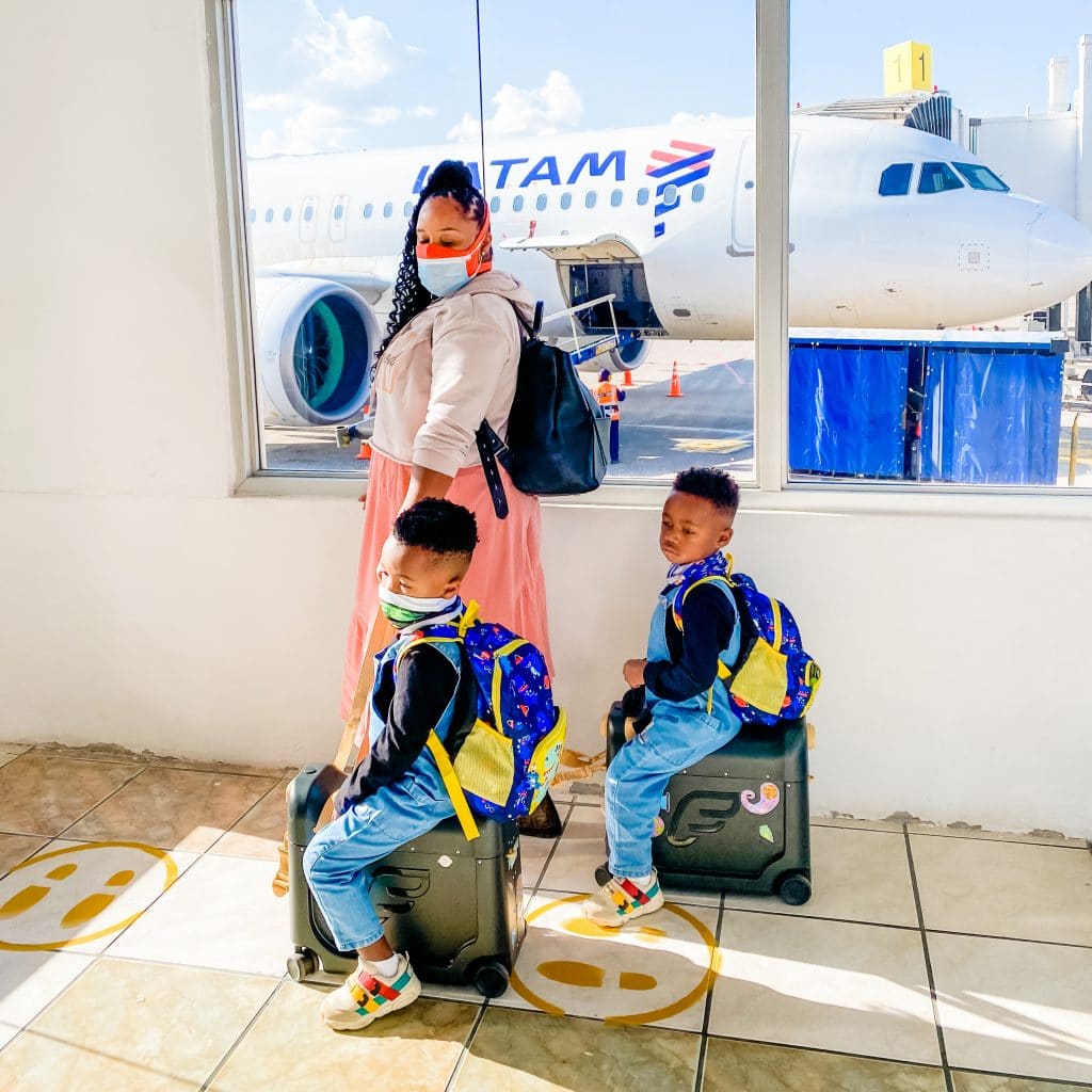 My boys with their toddler backpacks and luggage about to board the plane to Peru. 