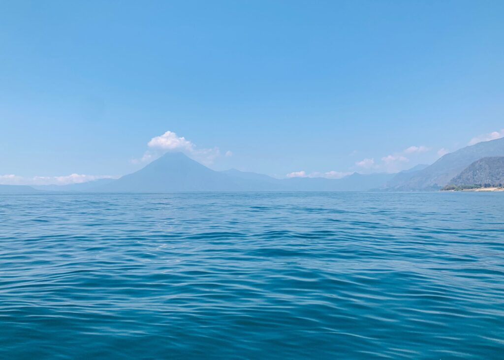 Panoramic view of Lake Atitlan surrounded, highlighting the serene beauty of this popular destination on the way from Antigua to the lake.