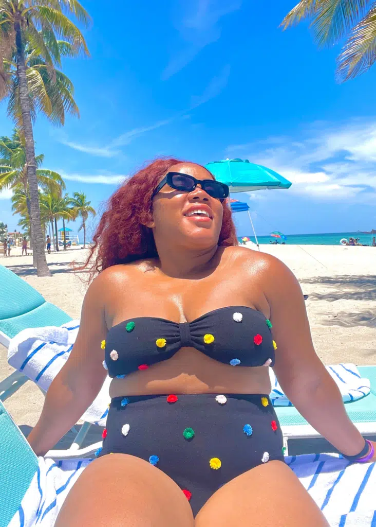 Me hanging out on Hollywood Beach with a pom pom 2 piece swimsuit. The Boardwalk makes it a great beach for families in the Miami area.