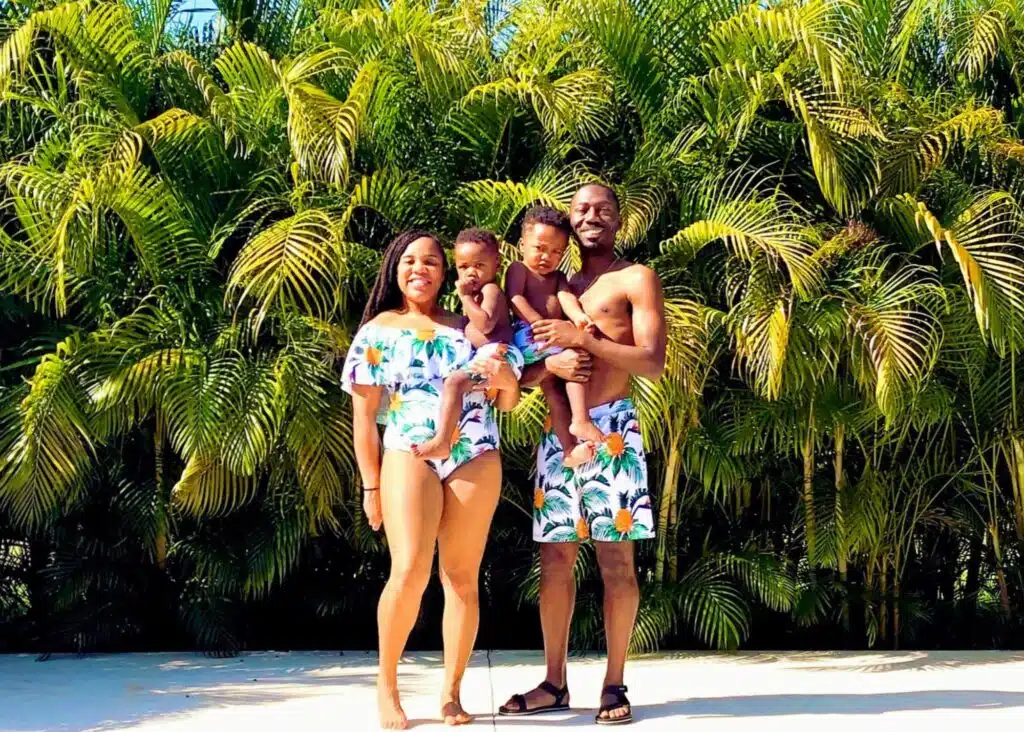 My family in coordinating bathing suits in front of a collection of palm trees at our vacation rental in Tamarindo.