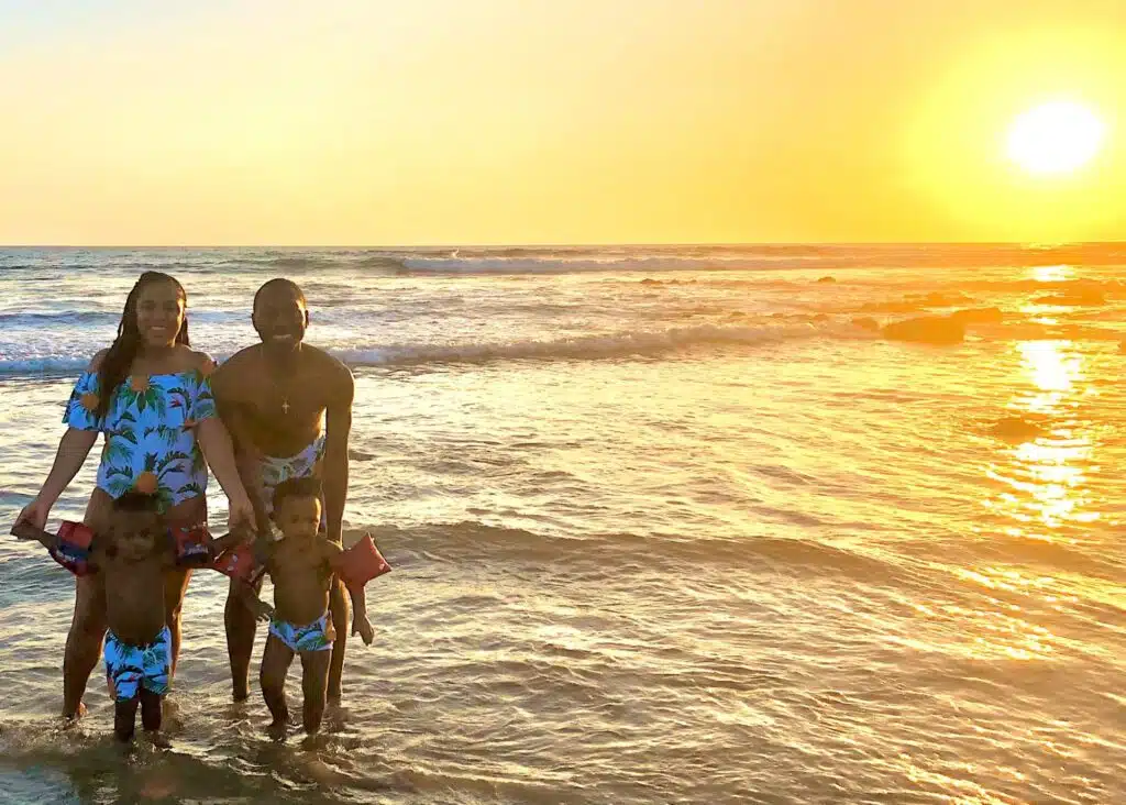 Our family on the beach at sunset in Tamarindo Town, Costa Rica.
