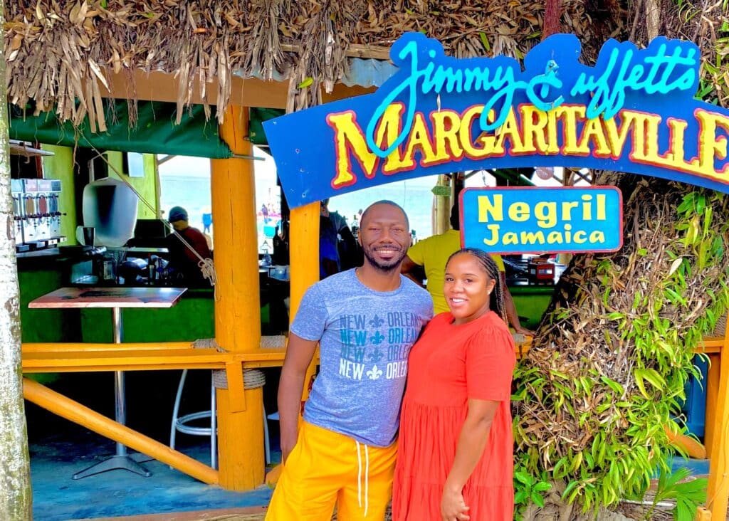 Photo of us in front of Margaritaville, Jamaica, ready for dinner.