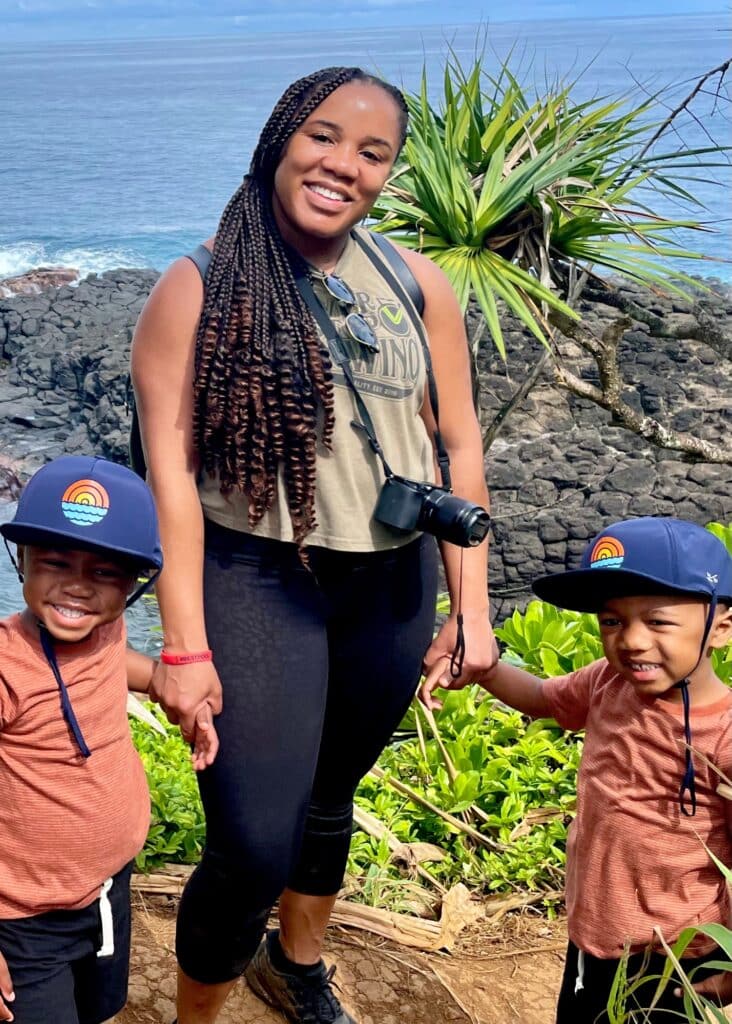 Me and the twins in our hiking gear, smiling during our Queen's Bath hike in Kauai, Hawaii.