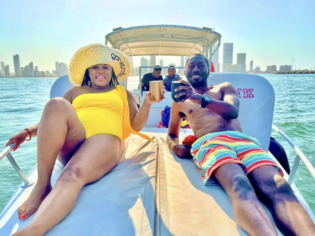 My husband and I relaxing on a private boat tour to Rosario Island from Cartagena- a perfect add to a Cartagena itinerary 
