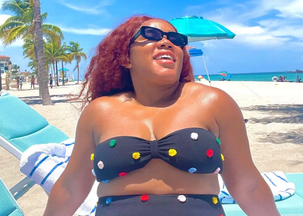 Wearing sunglasses on the beachโbe sure to pack these for Colombia.