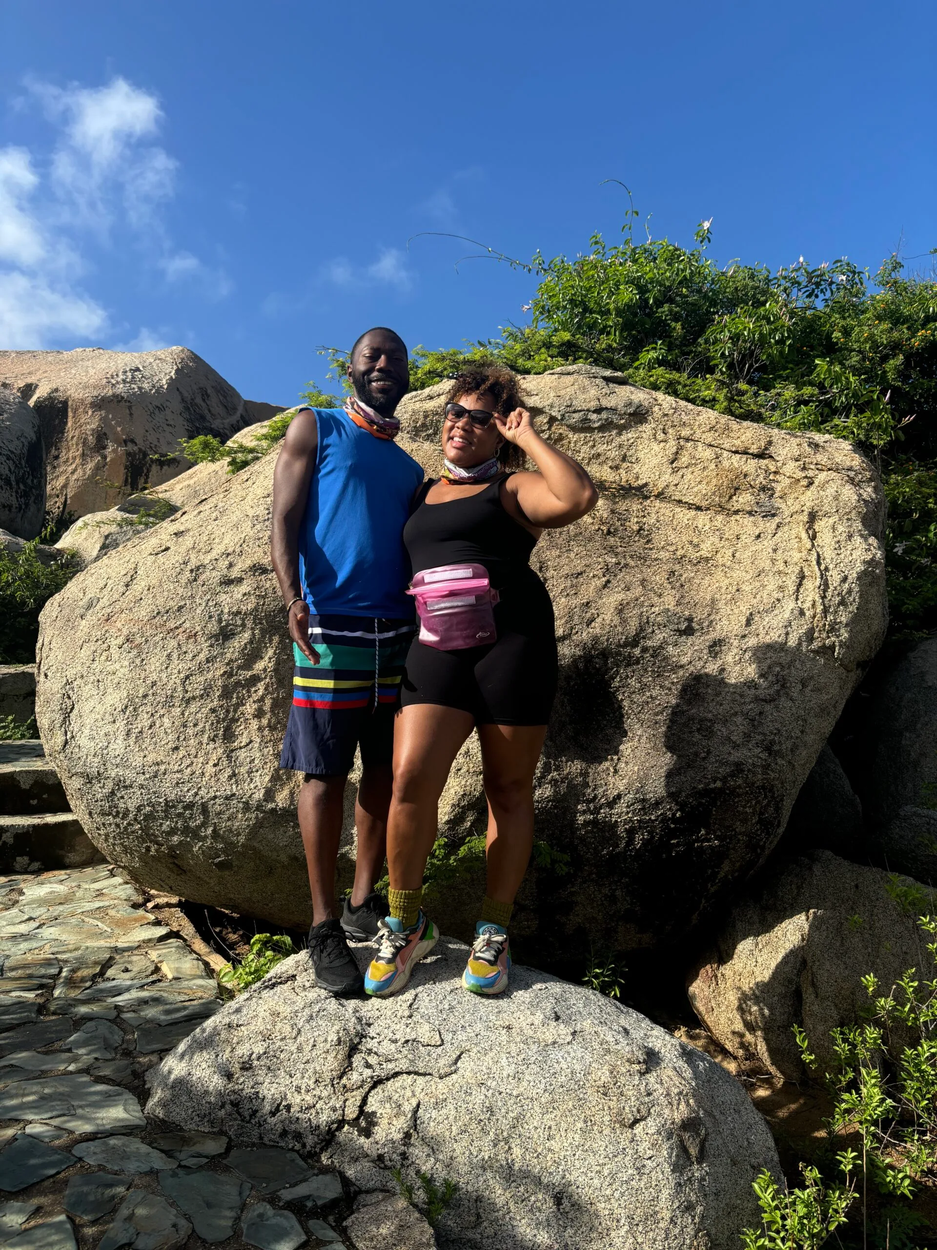 My husband and I posing on top of a rock formation at Ayo in Aruba. 