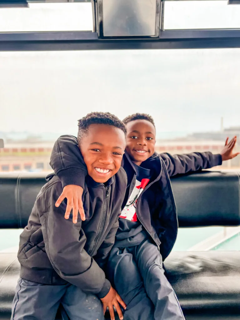 My twin boys, 7 years old, smiling on the Navy Pier Ferris Wheel in Chicago