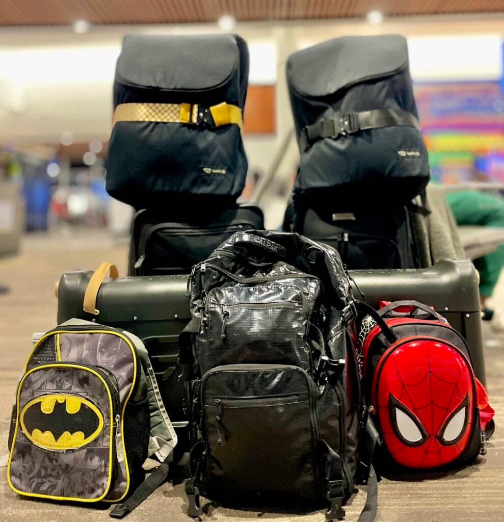 family of 4, packing light with carry-on only luggage, WAYB Pico Car Seats, and JetKids BedBox to easily get through airport security