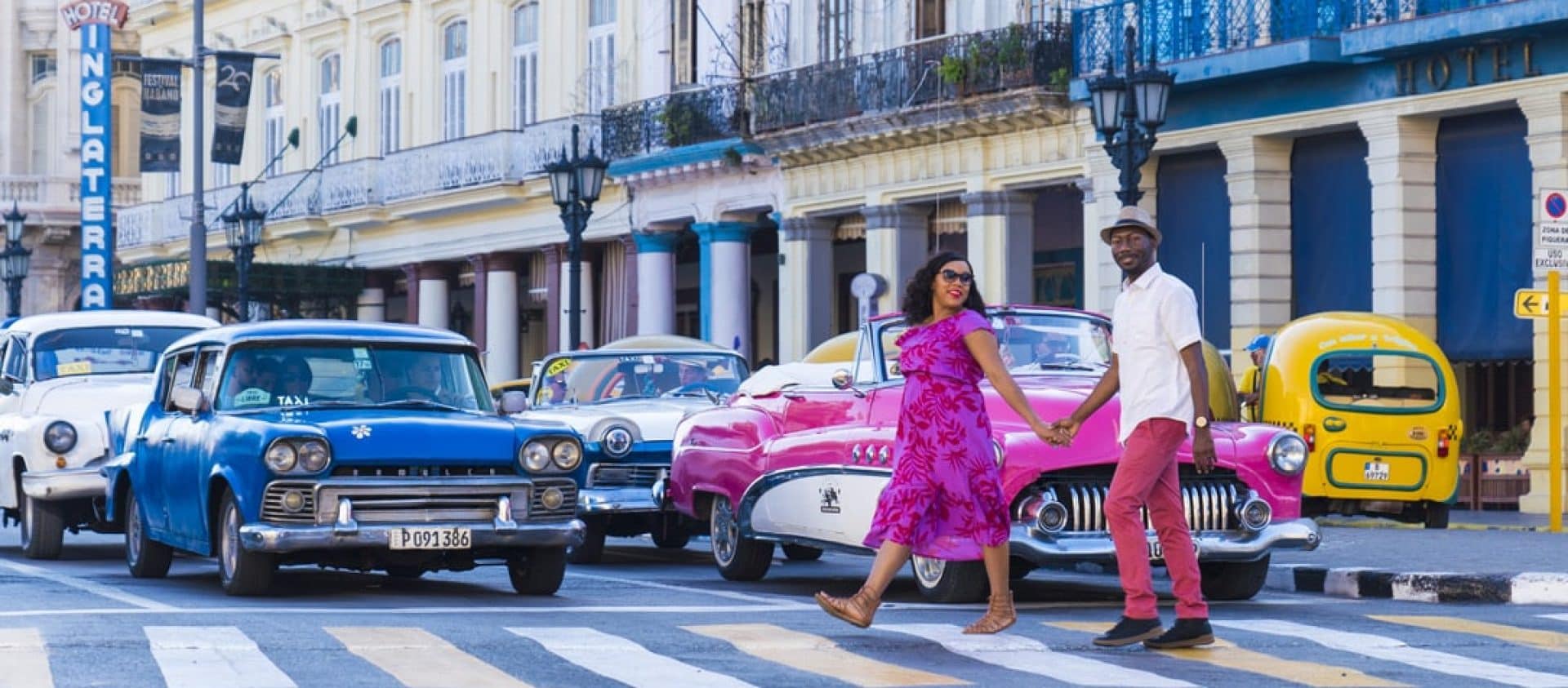 Couple walking across the street in Havana, Cuba