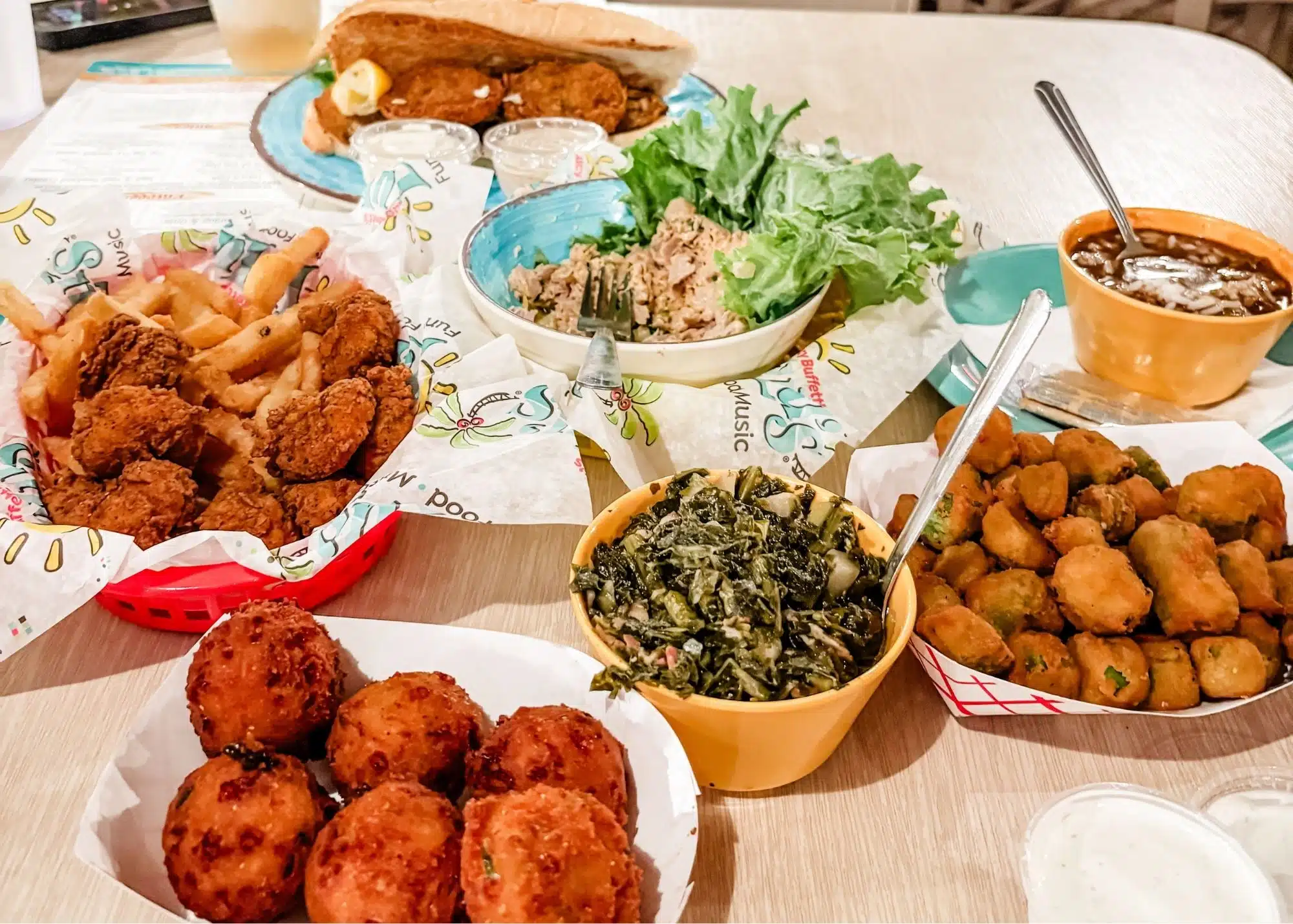 A table filled with Southern dishes at LuLu’s in Gulf Shores including fried seafood and fries. Marquita’s favorite was the smoked tuna dip served with chips and fresh lettuce.